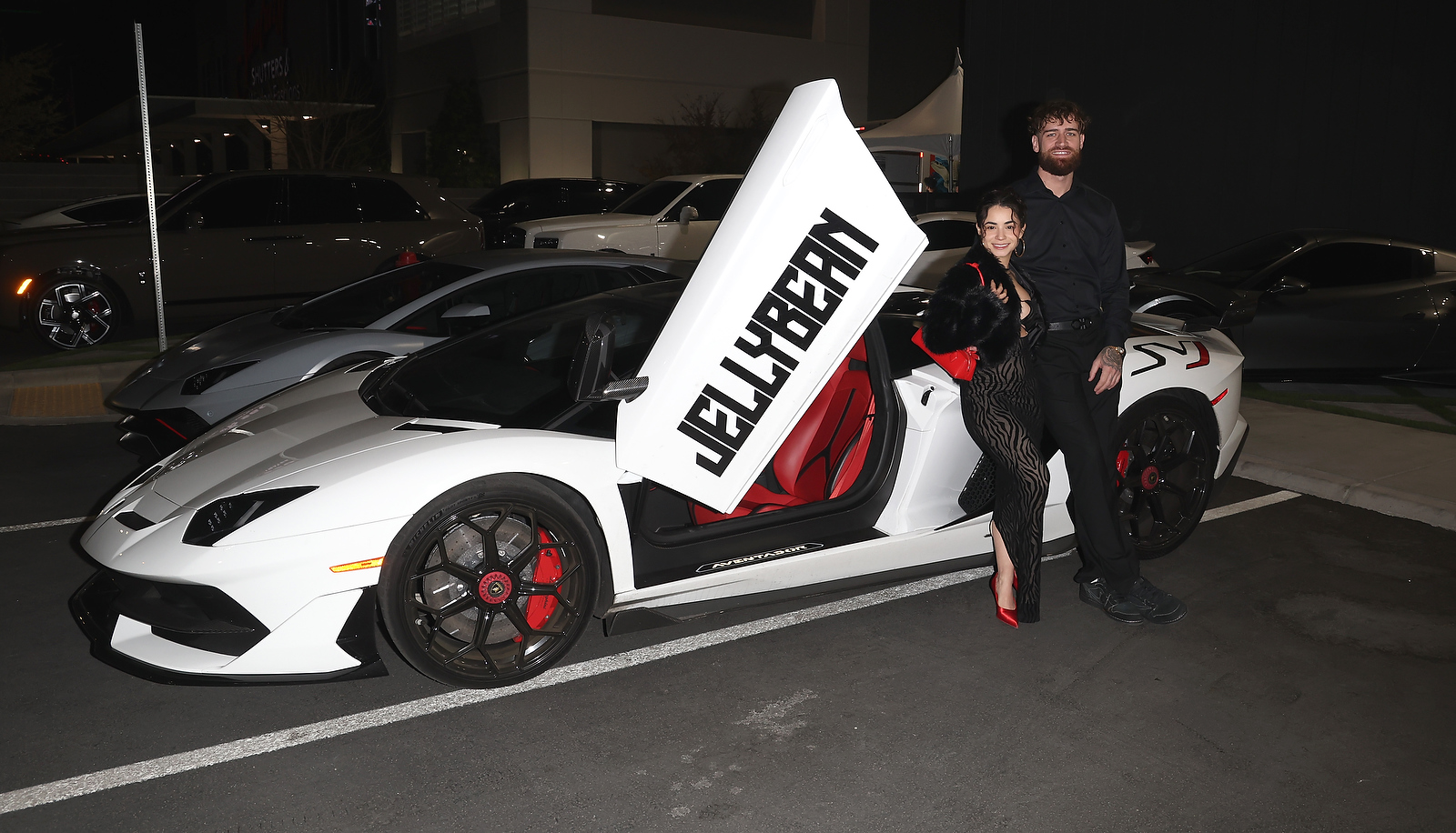 LAS VEGAS, NEVADA - DECEMBER 07: Jameliz Benitez Smith aka Jellybean.irl (L) and Jake Rosenbauer attend the grand opening of Vegas Auto Gallery on December 07, 2024 in Las Vegas, Nevada. (Photo by Gabe Ginsberg/Getty Images for Vegas Auto Gallery)