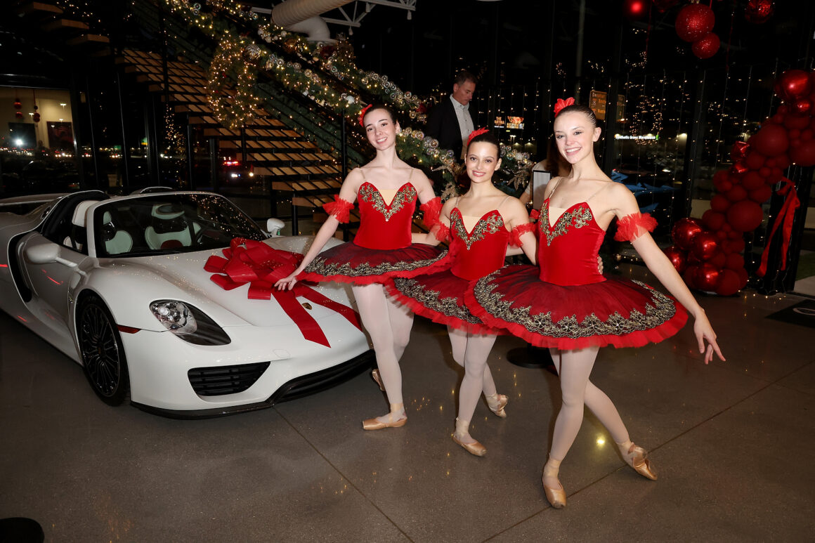 LAS VEGAS, NEVADA - DECEMBER 07: Vegas Nutcracker ballerinas pose with a Porsche during the grand opening of Vegas Auto Gallery on December 07, 2024 in Las Vegas, Nevada. (Photo by Gabe Ginsberg/Getty Images for Vegas Auto Gallery)