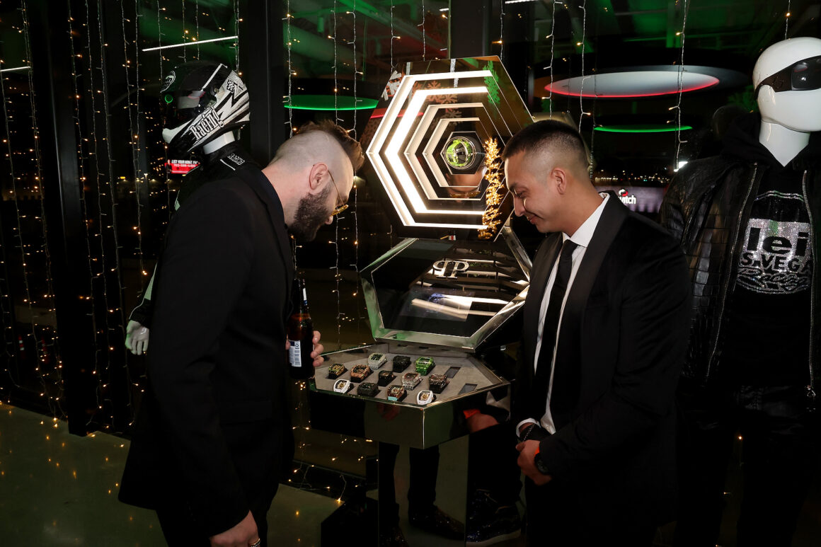 LAS VEGAS, NEVADA - DECEMBER 07: Attendees interact with the Philipp Plein watch tower during the grand opening of Vegas Auto Gallery on December 07, 2024 in Las Vegas, Nevada. (Photo by Gabe Ginsberg/Getty Images for Vegas Auto Gallery)