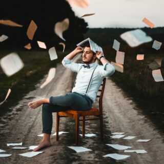 IQ Test guy with books raining down on him.