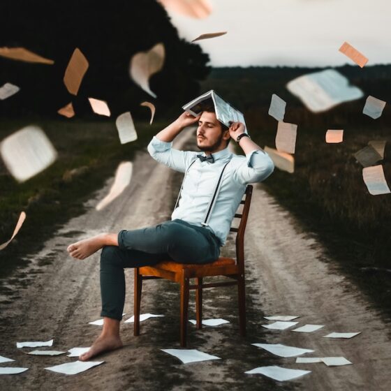 IQ Test guy with books raining down on him.