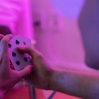 Poker player with purple background and lighting.