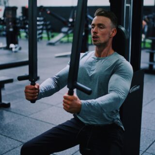 Guy working out at a gym.