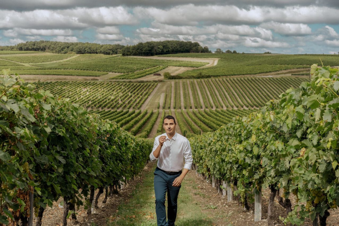 Baptiste Loiseau Remy Martin's youngest cellar master in the cognac wine region of France in the vineyard 