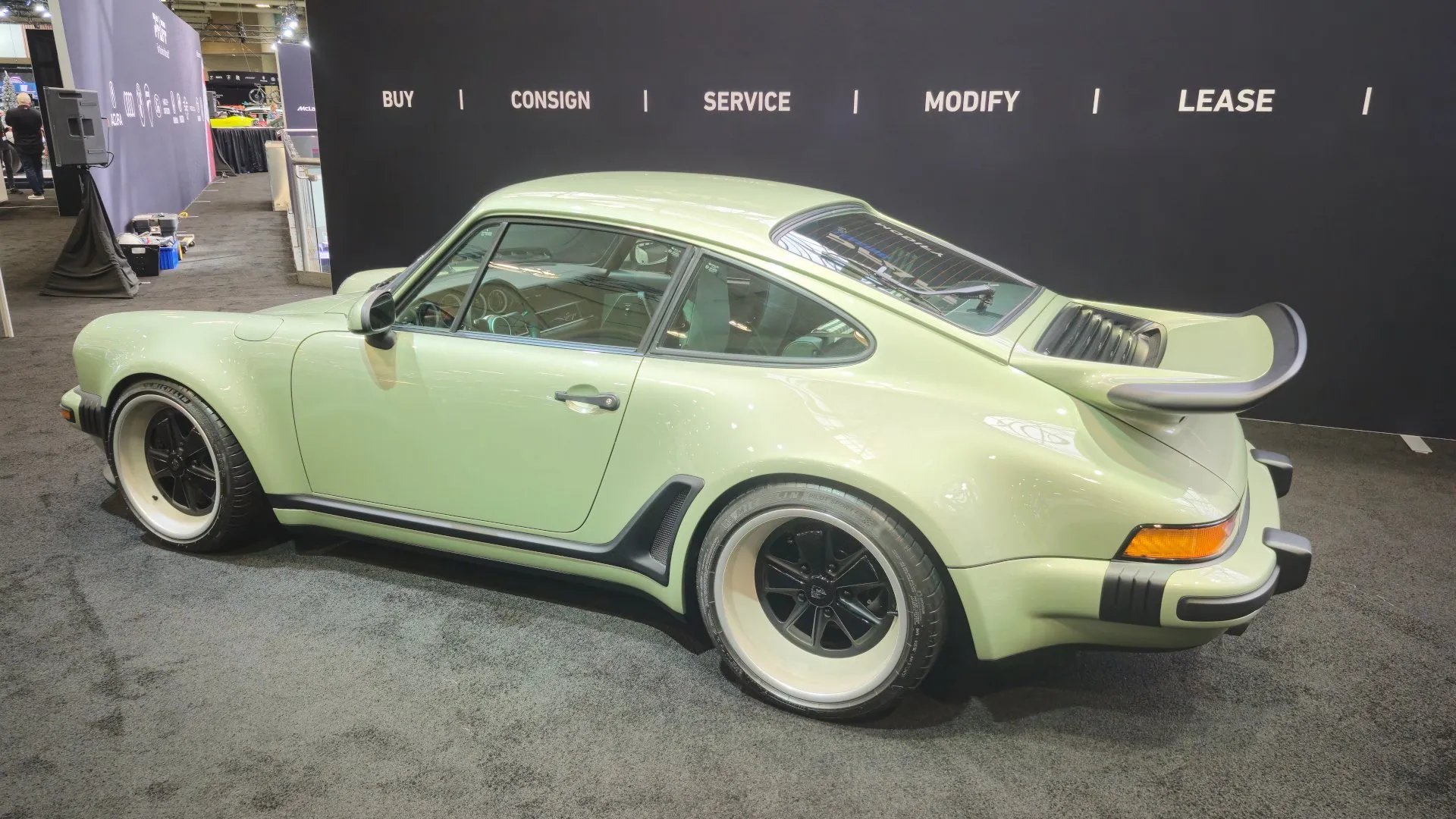 A mint-green classic turbo Singer Porsche 911 at the 2026 Canadian International AutoShow this year