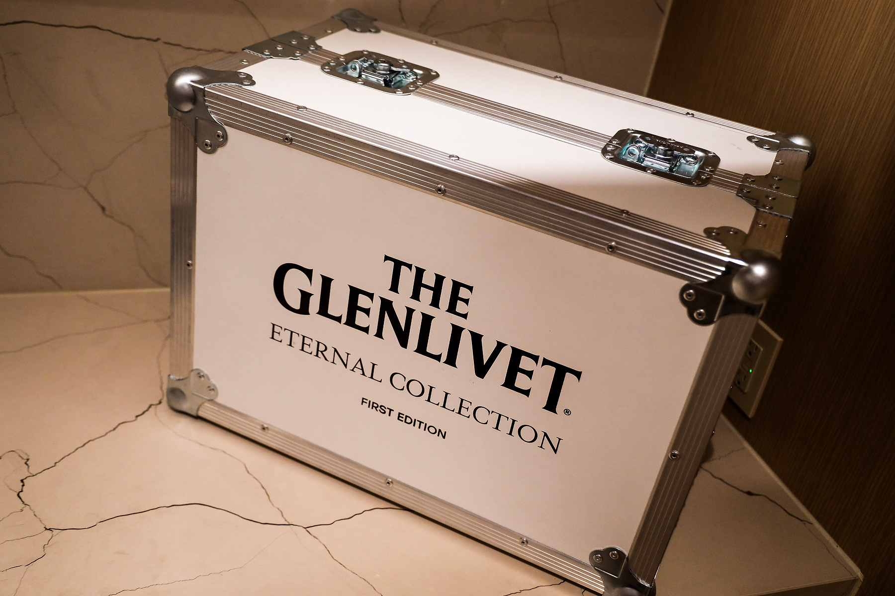 cage box Owen Gallagher, The Glenlivet brand ambassador walks us through a tasting of a flight of expressions including the 22yo he's seen here holding. (Photo: Steven Branco for Gent's Post / View the VIBE)