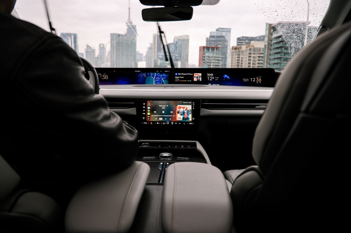 View of the centre console and panoramic screen from passenger seat second row