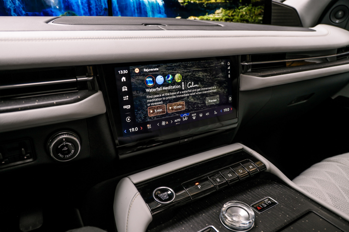 Calm app on the console of the Lincoln Black Label Rejuvenate experience interior waterfall meditation